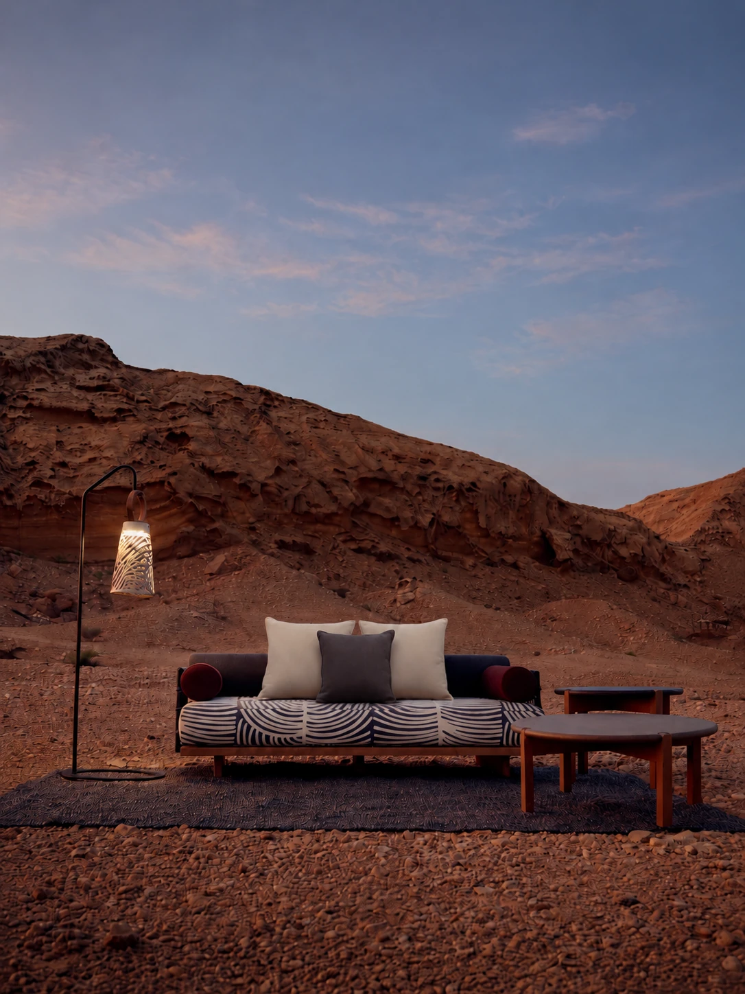 Outdoor sofa in a desert landscape at dusk